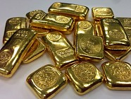 Цена на золото по итогам вечернего межбанковского фиксинга в Лондоне в пятницу понизилась